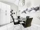 Bright dining area with modern light fixture and artwork at 4477 67Th N St, St Petersburg, FL 33709
