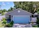 Delightful home with a two-car garage, enhanced by a lush front lawn and attractive landscaping features at 4477 67Th N St, St Petersburg, FL 33709