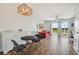 Living room with red couch, lake view, and sliding doors at 4538 Kennewick Pl, Riverview, FL 33578