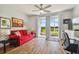 Living room with red couch and lake view at 4538 Kennewick Pl, Riverview, FL 33578