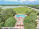 Community pool and clubhouse with surrounding landscape at 4538 Kennewick Pl, Riverview, FL 33578