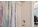 Clean bathroom with a shower/tub combo and a patterned shower curtain at 4538 Kennewick Pl, Riverview, FL 33578