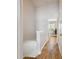 Upstairs hallway with wood-look tile floors and access to bedrooms at 4538 Kennewick Pl, Riverview, FL 33578