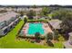 Community pool with lounge chairs and a covered patio area at 4538 Kennewick Pl, Riverview, FL 33578