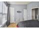 Well-lit bedroom with double closets and wood-look tile flooring at 4538 Kennewick Pl, Riverview, FL 33578