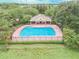 Community pool with a covered patio and lush landscaping at 4538 Kennewick Pl, Riverview, FL 33578