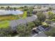Aerial view of townhomes near a lake at 4538 Kennewick Pl, Riverview, FL 33578