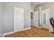 Spacious home office with wood-look floors and neutral walls at 4538 Kennewick Pl, Riverview, FL 33578