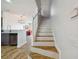 Interior view of a staircase with tile flooring and wooden handrail leading to the upper level at 4538 Kennewick Pl, Riverview, FL 33578