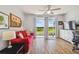 Living room with red couch and lake view at 4538 Kennewick Pl, Riverview, FL 33578