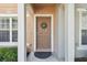 Inviting front door entrance with a wreath, leading into a charming home at 4538 Kennewick Pl, Riverview, FL 33578