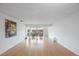 Spacious living room with hardwood floors and large windows at 19029 Us Highway 19 N # 6-19, Clearwater, FL 33764