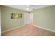 Charming bedroom with light green walls and hardwood floors at 19029 Us Highway 19 N # 6-19, Clearwater, FL 33764