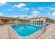Refreshing community pool surrounded by lush landscaping at 19029 Us Highway 19 N # 6-19, Clearwater, FL 33764