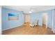 Spacious bedroom with light blue walls and hardwood floors at 19029 Us Highway 19 N # 6-19, Clearwater, FL 33764