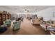 Spacious community room with comfortable seating and books at 19029 Us Highway 19 N # 6-19, Clearwater, FL 33764