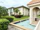 Relaxing water fountain in condo community with lush landscaping at 19029 Us Highway 19 N # 6-19, Clearwater, FL 33764