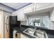 Kitchen features stainless steel appliances and a pass-through window at 19029 Us Highway 19 N # 6-19, Clearwater, FL 33764