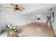 Bright living room with hardwood floors and a ceiling fan at 19029 Us Highway 19 N # 6-19, Clearwater, FL 33764