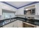 Modern kitchen with stainless steel appliances and white cabinets at 19029 Us Highway 19 N # 6-19, Clearwater, FL 33764