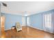 Serene bedroom with light blue walls, hardwood floors and ceiling fan at 19029 Us Highway 19 N # 6-19, Clearwater, FL 33764