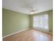 Peaceful bedroom with light green walls and hardwood floors at 19029 Us Highway 19 N # 6-19, Clearwater, FL 33764