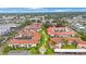 Aerial view of condo community showcasing building arrangement and landscaping at 19029 Us Highway 19 N # 6-19, Clearwater, FL 33764