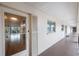 Condo hallway with access to individual units at 19029 Us Highway 19 N # 6-19, Clearwater, FL 33764