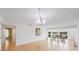 Bright living room with hardwood floors and access to a balcony at 19029 Us Highway 19 N # 6-19, Clearwater, FL 33764