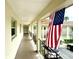 Clean condo hallway with American flag at 19029 Us Highway 19 N # 6-19, Clearwater, FL 33764