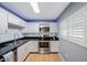 Bright kitchen with stainless steel appliances and white cabinets at 19029 Us Highway 19 N # 6-19, Clearwater, FL 33764