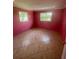 Bright bedroom with pink walls and tile floors at 200 Race Track S Rd, Oldsmar, FL 34677