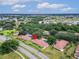 Scenic aerial view of community showcasing mature trees, lush landscaping, and manicured sidewalks at 120 Knollpoint Dr, Sun City Center, FL 33573