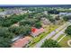 Breathtaking aerial view of a well-situated property nestled amidst lush greenery and community amenities at 120 Knollpoint Dr, Sun City Center, FL 33573