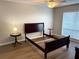 Empty bedroom with hardwood flooring, ceiling fan and natural light from the window at 120 Knollpoint Dr, Sun City Center, FL 33573