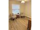 Bedroom with hardwood floors, a ceiling fan, and natural light from the window at 120 Knollpoint Dr, Sun City Center, FL 33573