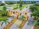 The grand entrance gate is surrounded by lush landscaping and a secure checkpoint at 120 Knollpoint Dr, Sun City Center, FL 33573