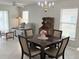 Open concept living and dining areas with tile floors, comfortable seating and natural light at 120 Knollpoint Dr, Sun City Center, FL 33573
