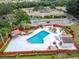 A clean pool and landscaped courtyard provides residents with a resort-style living experience at 120 Knollpoint Dr, Sun City Center, FL 33573