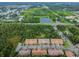 Aerial view of townhomes showcasing community's proximity to nature and nearby amenities at 12311 Terracina Chase Ct, Tampa, FL 33625