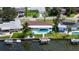 Waterfront property with private pool, boat dock, and lush landscaping at 537 Dolphin Se Ave, St Petersburg, FL 33705