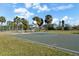Outdoor basketball court with palm trees and a clear sky at 537 Dolphin Se Ave, St Petersburg, FL 33705