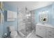 Modern bathroom with a glass shower and white vanity at 537 Dolphin Se Ave, St Petersburg, FL 33705