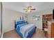 Guest bedroom with blue bedding and built-in shelving at 537 Dolphin Se Ave, St Petersburg, FL 33705