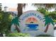 Welcome to Coquina Key sign with palm trees and waterfront background at 537 Dolphin Se Ave, St Petersburg, FL 33705