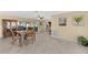 Bright dining area with hardwood floors and kitchen views at 537 Dolphin Se Ave, St Petersburg, FL 33705