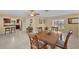 Spacious dining area with adjacent kitchen and hardwood floors at 537 Dolphin Se Ave, St Petersburg, FL 33705