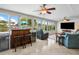 Gathering room features large windows, water view, and a sectional sofa at 537 Dolphin Se Ave, St Petersburg, FL 33705