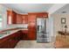 Modern kitchen with stainless steel appliances and wood cabinets at 537 Dolphin Se Ave, St Petersburg, FL 33705