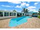 Inviting kidney-shaped pool with patio and canal views at 537 Dolphin Se Ave, St Petersburg, FL 33705